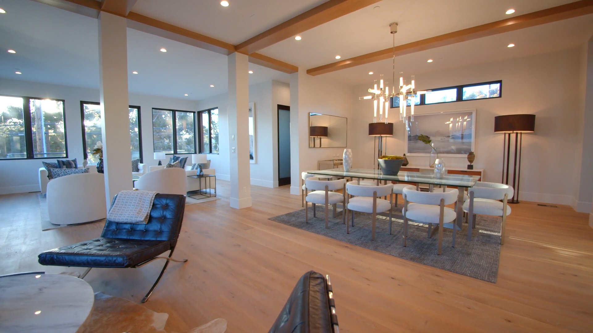 Luxury architectural interior showcase featuring bespoke living room, dining area, and designer kitchen